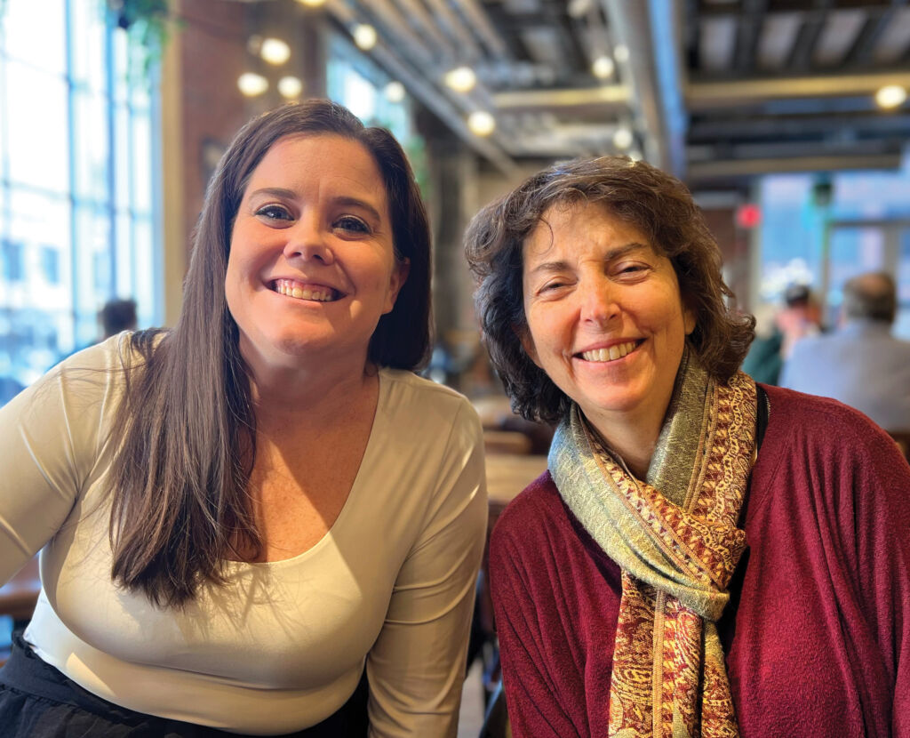 Two women smiling