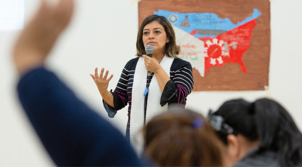 Woman speaking/presenting